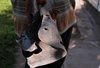 Віктор Григорович показує уламок ворожого дрона, який впав поряд з двором